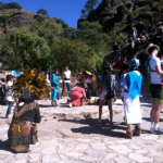 Local community members at a cultural event, some in head dress and authentic garments