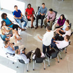 Businessman Addressing Multi-Cultural Office Staff Meeting During A Working Day