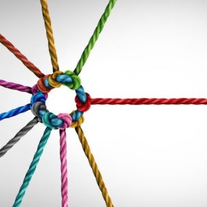 Multiple ropes that are different colors form a knot