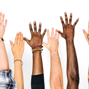 hands raised in air with their palms away from the camera