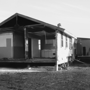 A dilapidated house in a black and white image