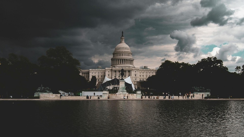A storm gathers over the US capitol building.