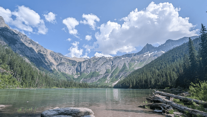A view of a lake and towering mountains at Glacier National Park