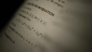 Close up on a book full of math equations.